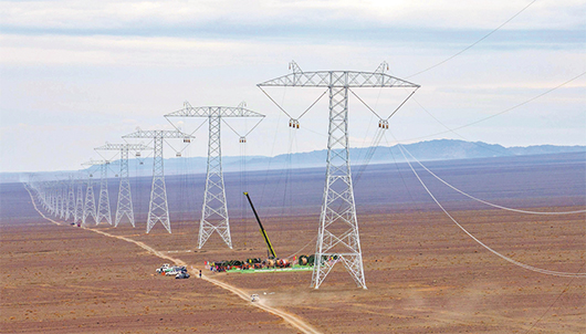 哈密—重慶±800千伏特高壓直流輸電工程建設(shè)現(xiàn)場(chǎng)。受訪者供圖